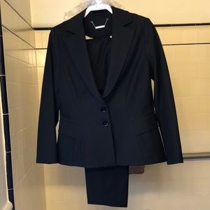 White House-Black Market black business suit worn once. Size 14